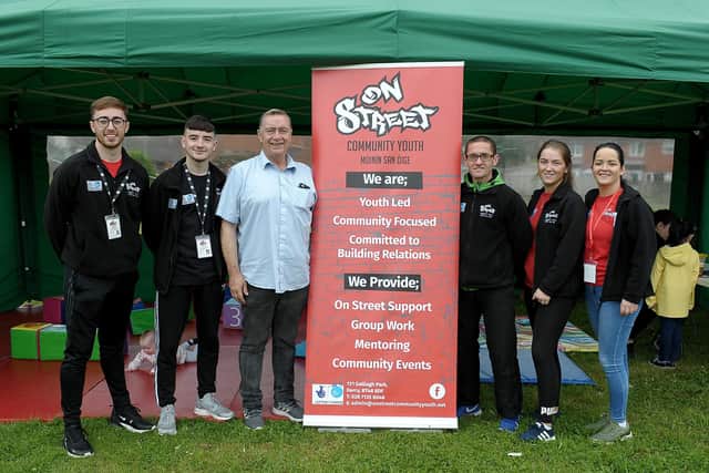 2019: Tommy McCallion (fourth from left) and Aileen Mellon (far right) with On Street Community Youth event organisers, pictured at the 2019 Galliagh Community Festival. DER3119GS-003