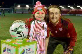 Nathan Gartside pictured with a young Derry City fan at Brandywell.