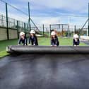 Lending a socially-distanced hand to the team from Hawthorn Heights Ltd, as they prepare for the full return to school next week at Faughanvale PS are, from left, brother and sister Ben and Hollie Craig, Olivia McGuinness, Danny Rankin and Charlie McKeever.