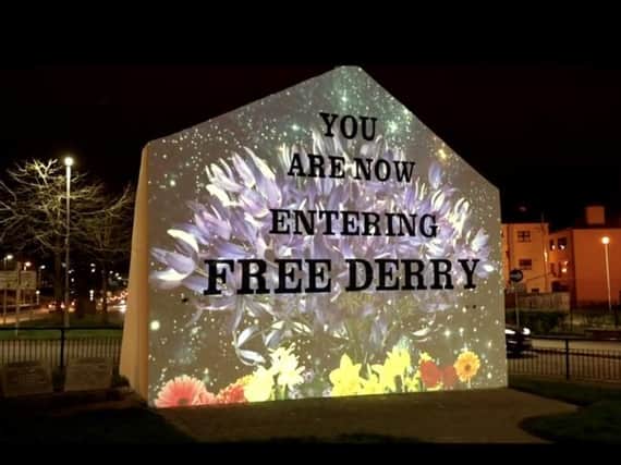 A projection by Visual Spectrum Studio at Free Derry Wall that features in Equinox.