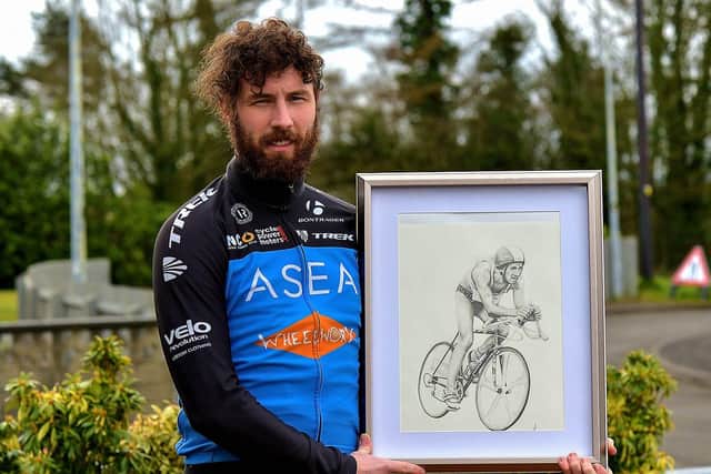 Danny Quigley, who will complete 10 ironman triathlons in 10 days, in memory of his late father, raising funds for suicide awareness pictured with a sketch of his dad. Photo: George Sweeney. DER2112GS - 001