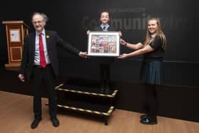 Education Minister Peter Weir is presented with a special memento by Molly McGee and Holly Bonner during Wednesdayâ€TMs  official opening of the newly refurbished Studio 2 Youth and Community Arts Centre. (Photos: Jim McCafferty Photography)