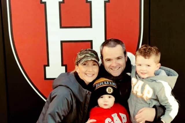 Mark pictured with his wife, Liz, and sons, Caelan and Ryan, at Harvard University.