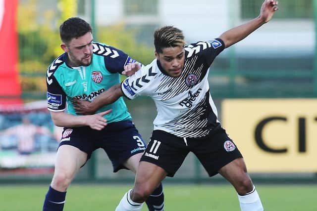Kaleem holds off the challenge of Derry City's Dean Jarvis while playing for Bohemians.