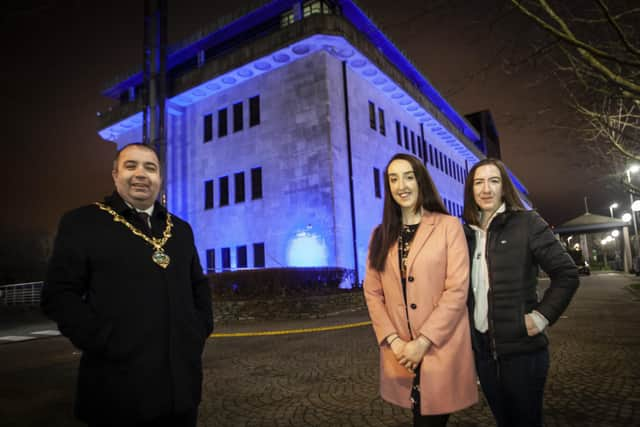 OVARIAN CANCER AWARENESS.. . . . . .The Mayor of Derry City and Strabane District Council, Brian Tierney pictured with Ovarian Cancer campaigner Natalie Cairns and her sister Angela at the Council Offices, Strand Road recently as they were lit up to raise awareness of Ovarian Cancer.