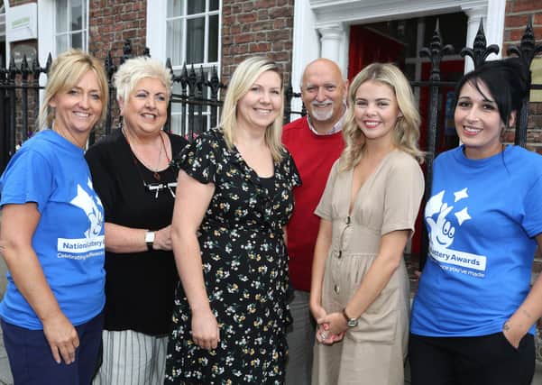 HURT representatives are among those being invited to speak about their work. (Pictured back in 2018 is Derry Girl Saoirse Monica Jackson (Erin) on a visit to National Lottery funded HURT (Have Your Tomorrows) family support group and suicide prevention charity, with staff members Pauline McCloskey, Sadie Reilly, Olivia Smith, Dessie Kyle and Tina Burns.)