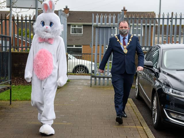 Derry City and Strabane District Council Mayor, Councillor Brian Tierney with the Easter bunny pictured during visits to local schoolchildren this week. Picture Martin McKeown. 29.03.21