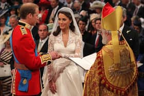 Prince William and Kate Middleton exchange rings in front of the Archbishop of Canterbury during their wedding at Westminster Abbey, on April 29, 2011 in London