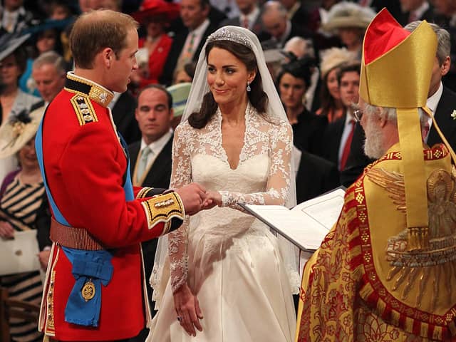 Prince William and Kate Middleton exchange rings in front of the Archbishop of Canterbury during their wedding at Westminster Abbey, on April 29, 2011 in London