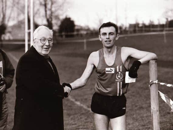 Bobby Farren is congratulated after winning his fourth successive Ulster Cross Country Championship in 1996
