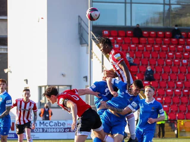 Danny Lupano rises highest to meet this ball during Derry City's Premier Division clash with Waterford. Photo by Kevin Moore.