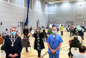 The Mayor Brian Tierney with Western Trust staff at the Foyle Arena vaccination hub.