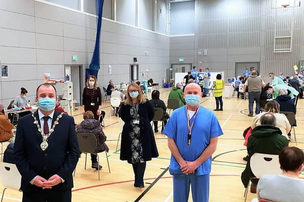 The Mayor Brian Tierney with Western Trust staff at the Foyle Arena vaccination hub.