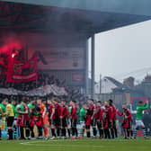 BANNED . . . Bohemians and Shamrock Rovers players shake hands prior to kick-off.