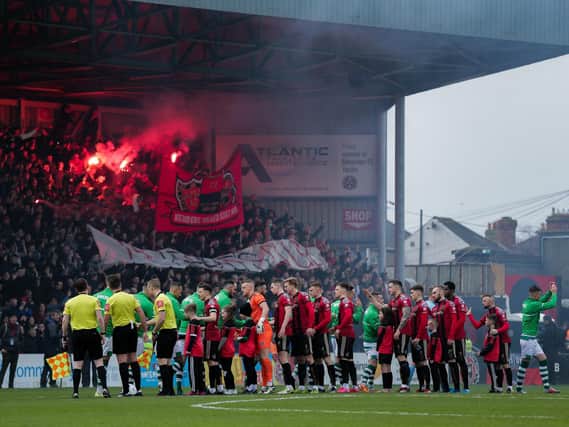 BANNED . . . Bohemians and Shamrock Rovers players shake hands prior to kick-off.