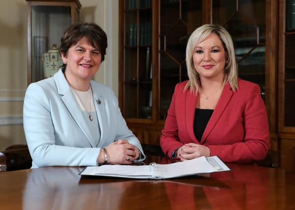 First Minister Arlene Foster with deputy First Minister Michelle O'Neill. Photo: Press Eye