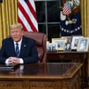 President Donald Trump speaks in an address to the nation from the Oval Office at the White House