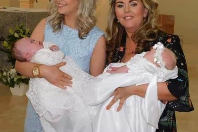 Sisters Aoife Tyre and Rosin Hamill with their children Tiernan and Zara on the day of their christening.