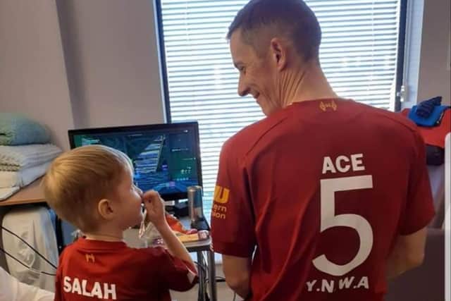 Liverpool and Celtic fanatics, Ace and his dad, Brian pictured in hospital.