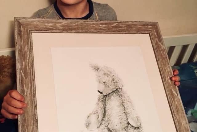 Jack Barnfield, the boy who inspired the story of Bear Shaped, with the sketch Dawn sent him after he lost his bear.