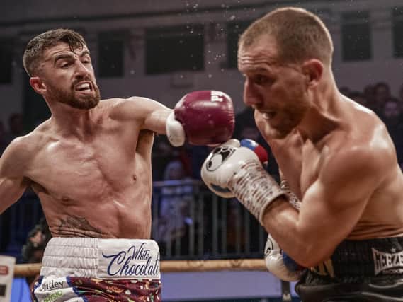 Tyrone McCullagh lands a left hand to British champion, Ryan Walsh during the Golden Contract semi-finals.