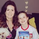 Author Joanne Henry with her daughter Hannah and her new book, Memoirs of a Mad Mammy.