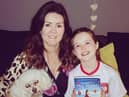 Author Joanne Henry with her daughter Hannah and her new book, Memoirs of a Mad Mammy.