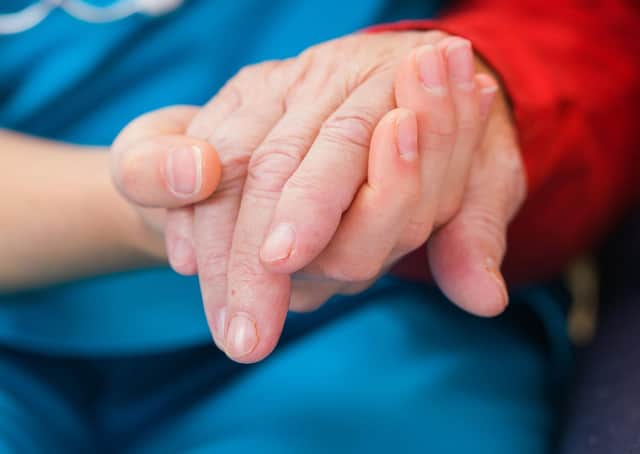 A Generic photo of nurse holding the hand of an elderly woman. See PA Feature HEALTH Alzheimers. Picture credit should read: iStock/PA. WARNING: This picture must only be used to accompany PA Feature HEALTH Alzheimers.