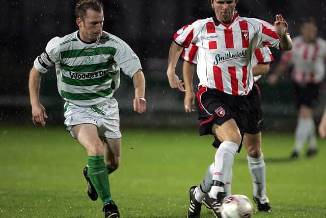 Derry City's Paddy McCourt skips away from Shamrock Rovers' Trevor Molloy.