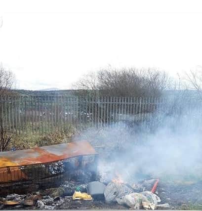 Illegally dumped waste set on fire along the Glassagh Road area of Creggan.
