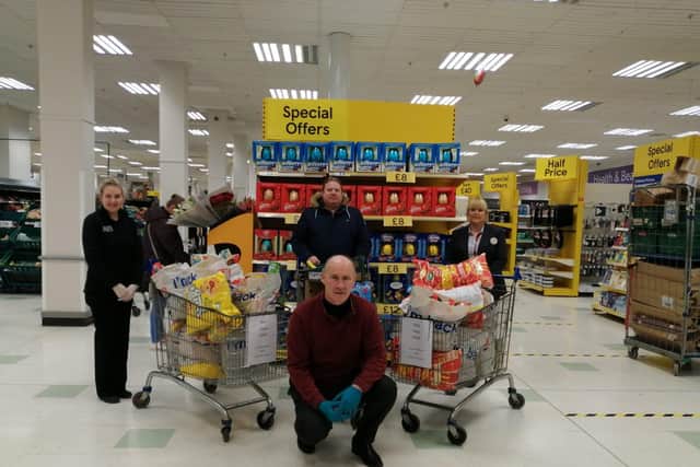 Unite Branch Secretary Gregory O'Kane(DuPont/Lycra Company) pictured with Tesco employees Catherine McLaughlin and Tanya McDermott during the Unite Union 'Shop for NHS' day at the Lisnagelvin store. The Branch Members donated 500 in support of Altnagelvin staff required in the frontline against Covid-19. Included is Branch Member Tim Gordon.