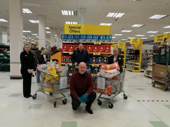 Unite Branch Secretary Gregory O'Kane(DuPont/Lycra Company) pictured with Tesco employees Catherine McLaughlin and Tanya McDermott during the Unite Union 'Shop for NHS' day at the Lisnagelvin store. The Branch Members donated 500 in support of Altnagelvin staff required in the frontline against Covid-19. Included is Branch Member Tim Gordon.