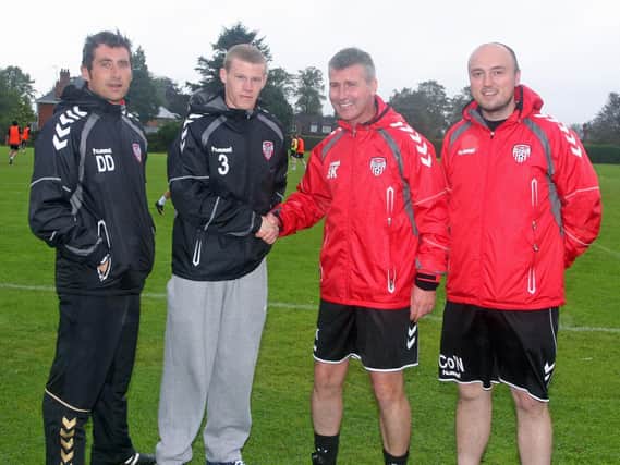 Derry City manager Stephen Kenny wishes Sunderland-bound James McClean all the best after his final training session with the Candy Stripes in 2011. Also pictured Declan Devine (left), coach and Colm ONeill, physio.