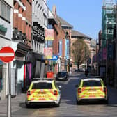 Shuttered stores and police patrols on Ann Street in Belfast, as the UK continues in lockdown to help curb the spread of the coronavirus. (Photo: PA Wire)