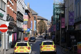 Shuttered stores and police patrols on Ann Street in Belfast, as the UK continues in lockdown to help curb the spread of the coronavirus. (Photo: PA Wire)