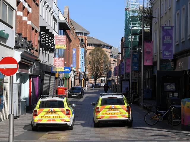 Shuttered stores and police patrols on Ann Street in Belfast, as the UK continues in lockdown to help curb the spread of the coronavirus. (Photo: PA Wire)