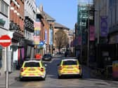 Shuttered stores and police patrols on Ann Street in Belfast, as the UK continues in lockdown to help curb the spread of the coronavirus. (Photo: PA Wire)
