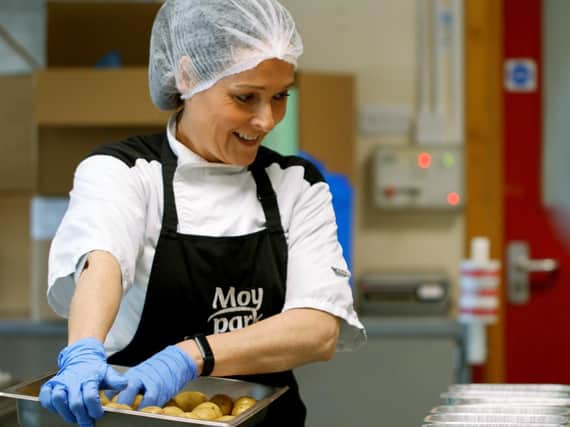 Moy Park chef Julia Winters is pictured helping prepare 1,000 meals for donation to The Resource Centre Derry.