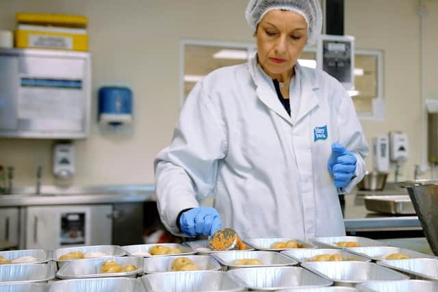 Paula Hall, Moy Park Home Economist is pictured helping prepare 1,000 meals for donation to The Resource Centre Derry.