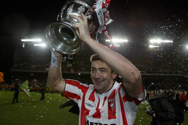 Peter Hutton holding aloft the FAI Cup after Derry City's memorable win over St Patrick's Athletic.
