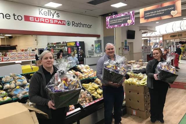 Adrian Kelly with Kelly’s Eurospar staff Patricia and Emma assembling the hampers at Ráth Mór.