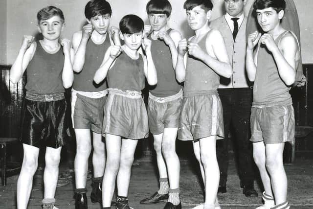 Charlie Nash (second from left) and his brother Willie (third from right) pictured in November 1966 with coach, Tommy Donnelly and other boxers from St Marys Club who figured prominently in the NW Area finals of the Association of Boys  Clubs Championships in Derry.