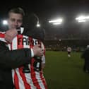 Stephen Kenny and the late Mark Farren embrace.