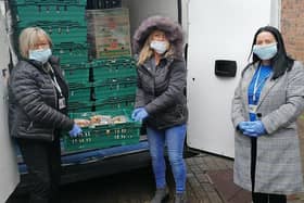 Ciara Ferguson and her team from Greater Shantallow Area Partnership (GSAP) unpack the Fareshare food being delivered by Apex Housing Association to distribute amongst local families.