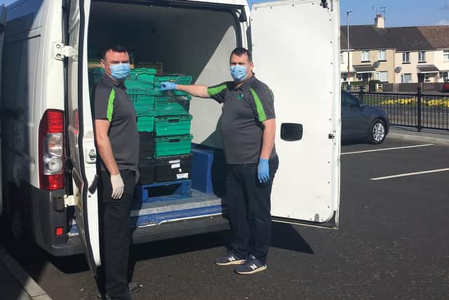 Staff from Waterside Neighbourhood Partnership unpack the Fareshare food being delivered by Apex Housing Association during the Covid-19 pandemic.