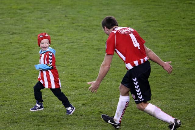 Barry Molloy celebrates with his son Rossa, age 3, after the 2012 FAI Cup Final at the Aviva.