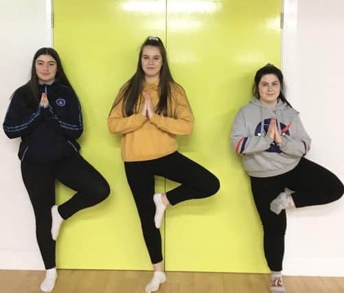 Hollie Breslin, Lilly Tabbit and Amy O Kane practising their tree pose