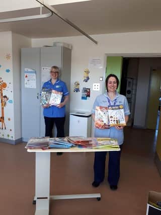 The Altnagelvin Parents Support Group donated 100 children's activity packs and colouring materials to the children's Covid-19 ward. Local company BitsnPieces also donated packs. Pictured with the donation are staff members Jenny Watt and Michelle O'Kane.