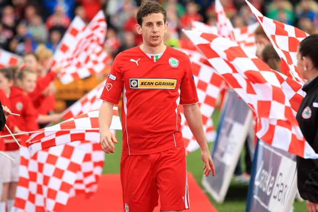 Eamonn Seydak walks the guard of honour after one of Cliftonvilles Danke Bank Premiership wins.