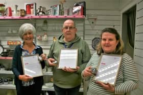 Cancer Research UK Derry City shop volunteers MsJoy Coskery and MrJim Kay with Jo.Mewett, Head of Retail Operations.